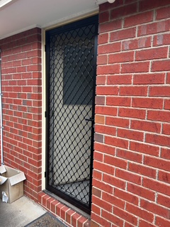 New black diamond mesh security screen door after installation