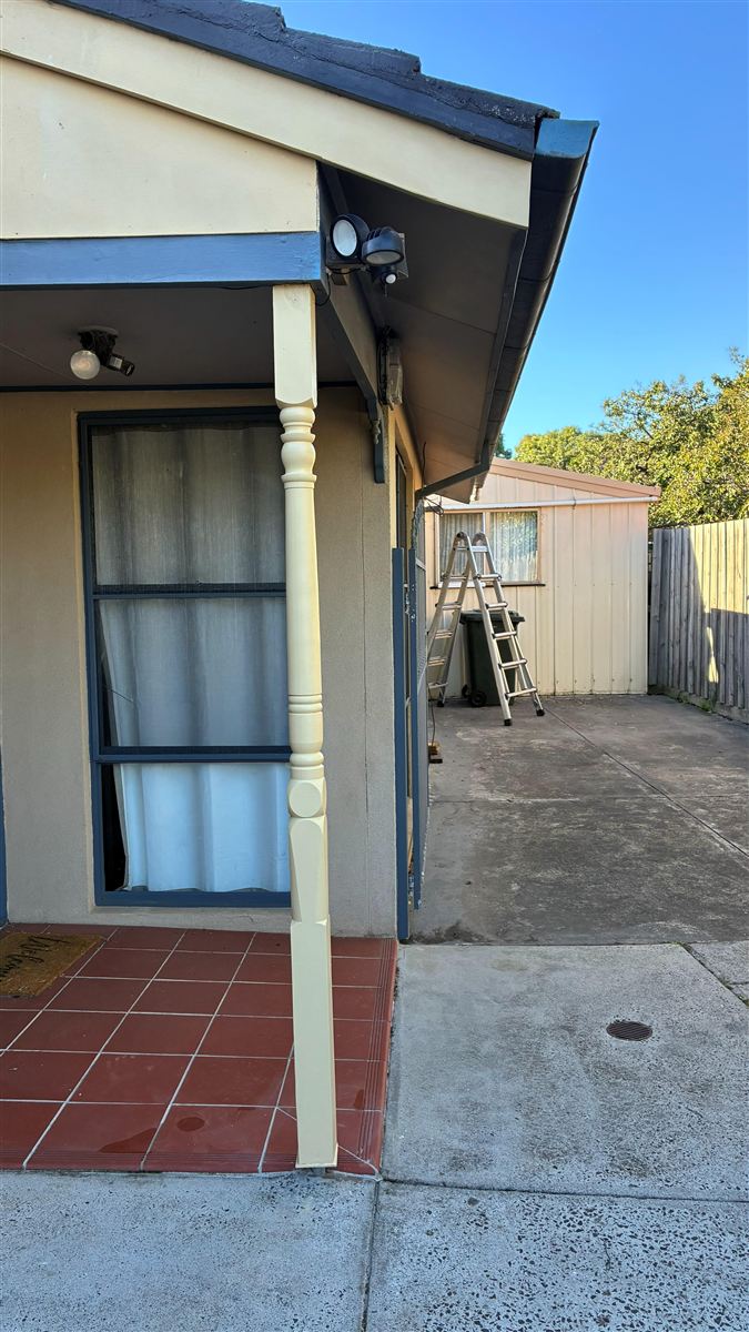 Repaired and repainted timber fascia and post after repair